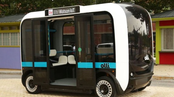 A black and white IBM self-driving vehicle with open doors