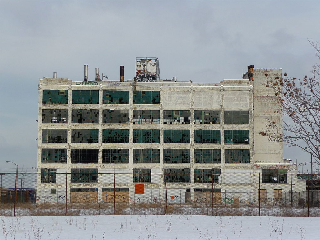 Abandoned large building with many broken windows