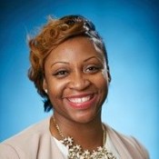 Black Woman Smiling in Beige Blouse