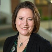 WHITE WOMAN SMILING WITH BROWN HAIR