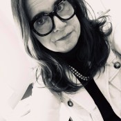 White woman w chunky glasses