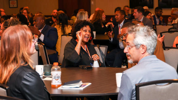 Leaders gathered at a table at GPLEX Chicago