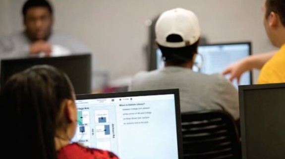 People working on laptops in a room