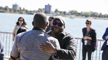 two attendees greeting one another