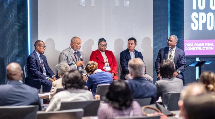 4 seated speakers on panel during PAGE 2023 R+C summit